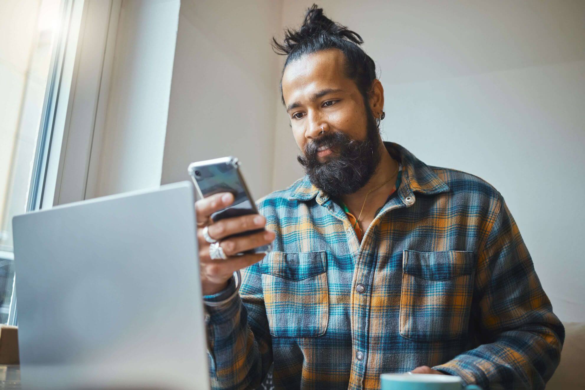 remote-work-phone-or-cafe-man-on-laptop-planning-o-2N79FKM.jpg
