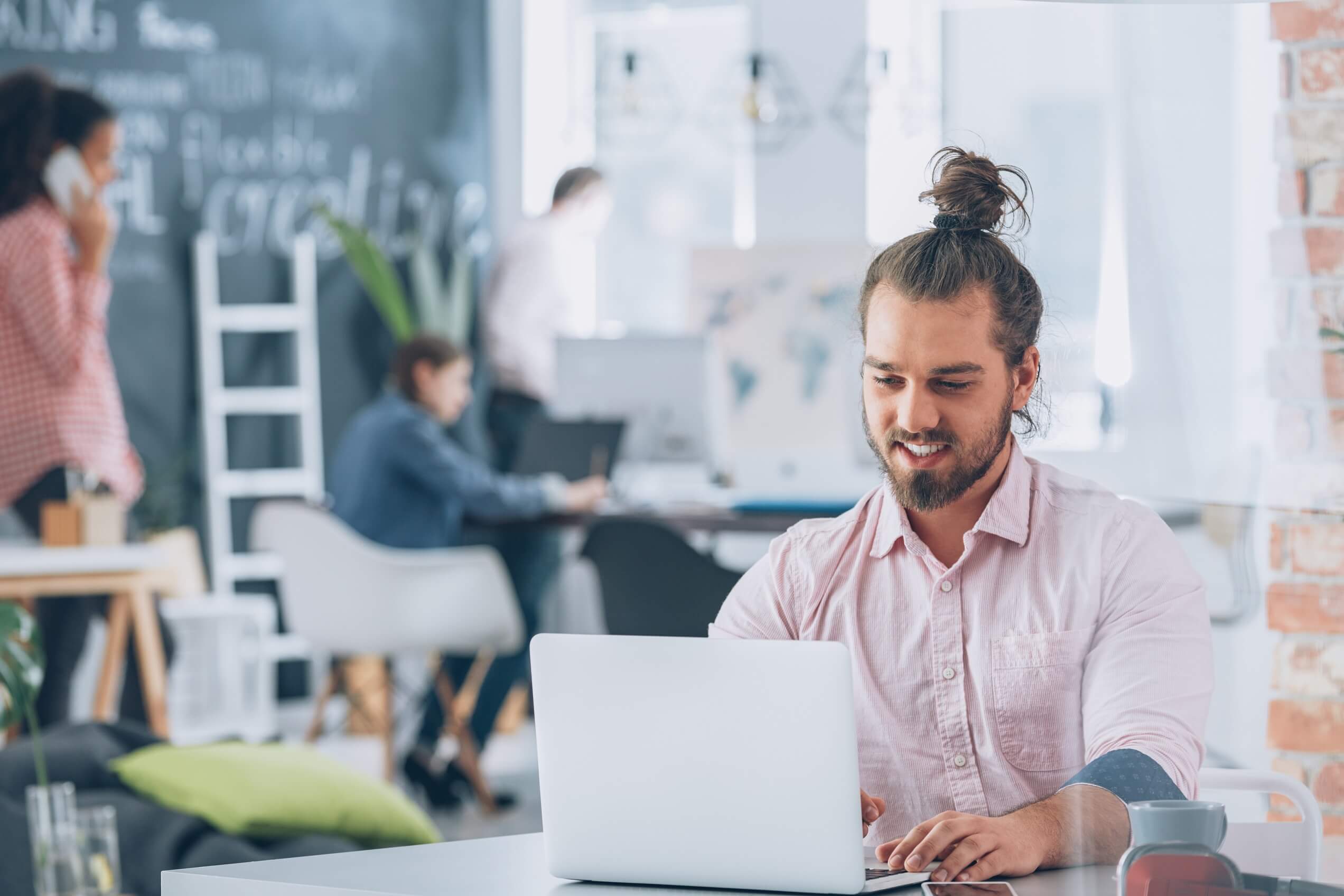 smiling-bearded-corporate-man-using-laptop-2021-08-26-15-44-54-utc.jpg