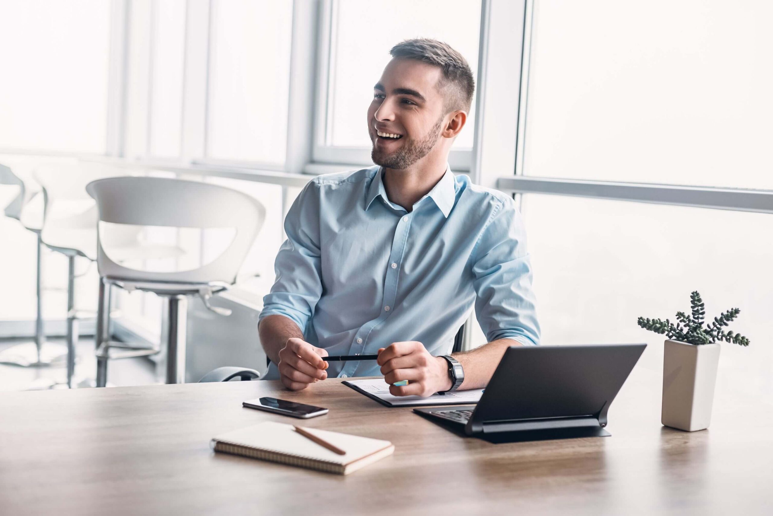 young-businessman-working-in-office-GV8QFMU-1.jpg